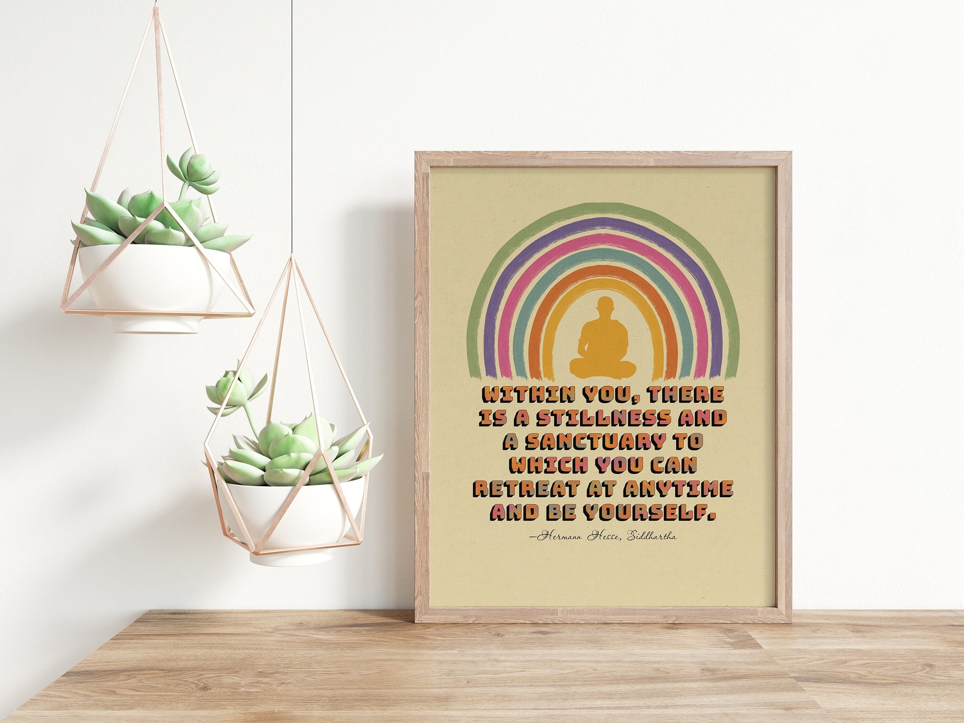 Siddhartha quote on inner stillness by Hermann Hesse & an illustration of a person meditating surrounded with rainbow poster in wood frame mockup