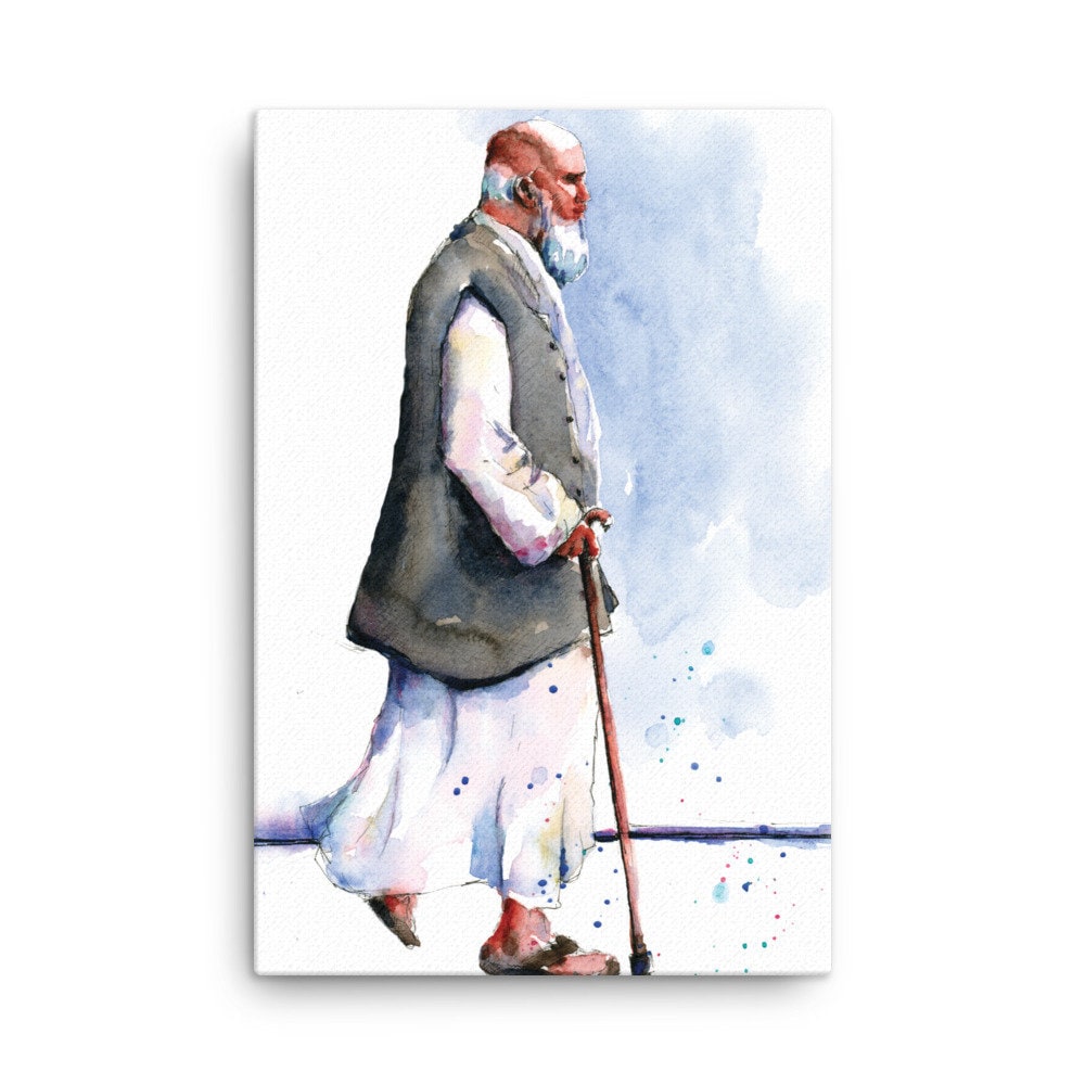 Old man Walking with cane wearing traditional muslim attire canvas print