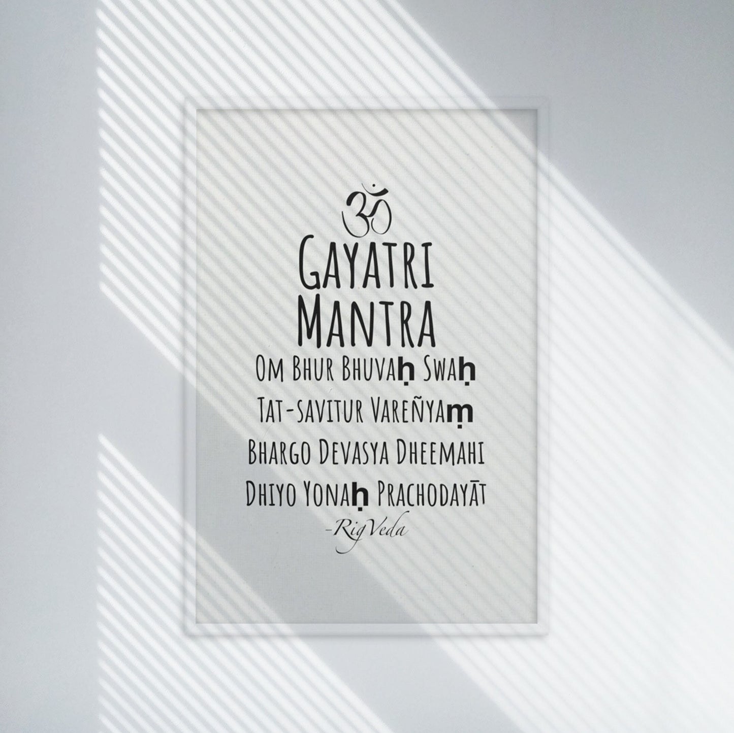 Gayatri mantra in english, black on white minimalist poster in white frame.