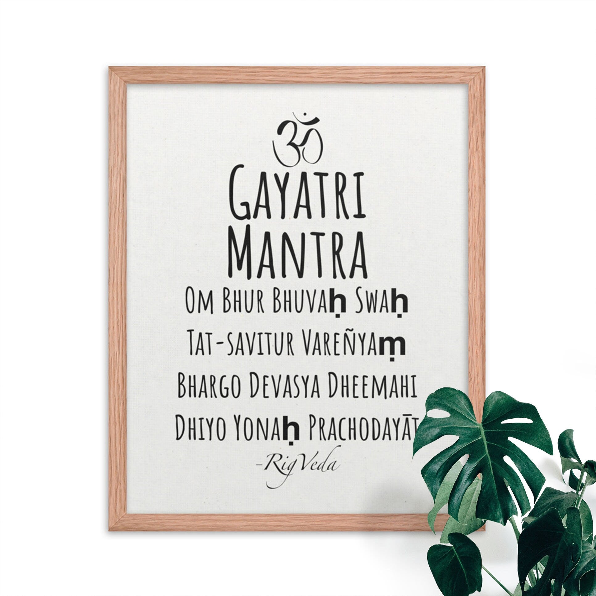 Gayatri mantra in english, black on white minimalist poster in oak frame.